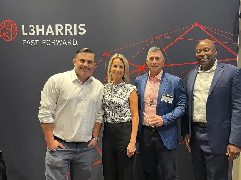 Tailwind Resource Group team members at an L3Harris event, celebrating their 2025 Small Business Supplier Excellence Award.